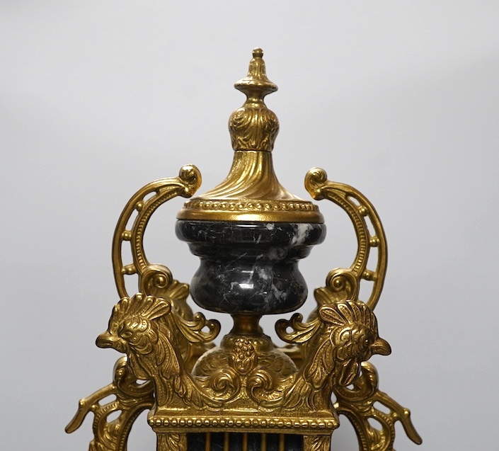 A bronze and marble three piece clock garniture, key, no pendulum, 69cm. Condition - good, not tested as working